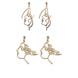 art touching face earrings